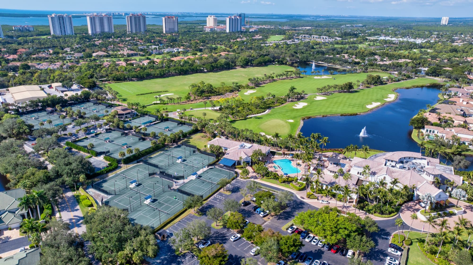 Aerial view of The Colony at Pelican Landing's golf course, lakes, and amenities in Bonita Springs
