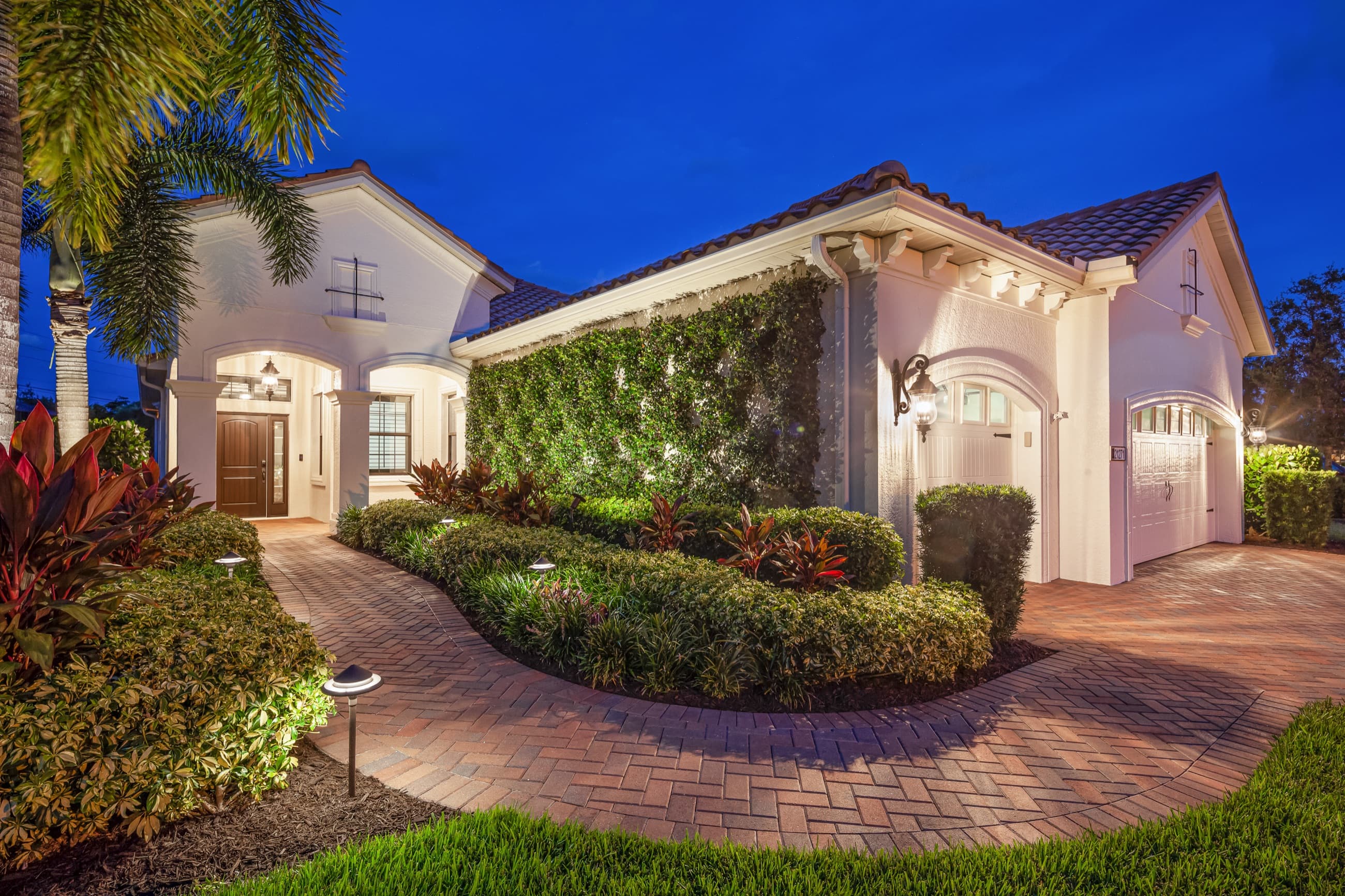 A professionally marketed estate listing in Southwest Florida at twilight